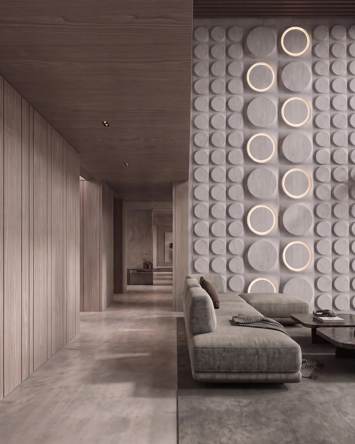 COSMIC 0012 gypsum 3D wall panel discs in two sizes with warm accent lighting, close view
