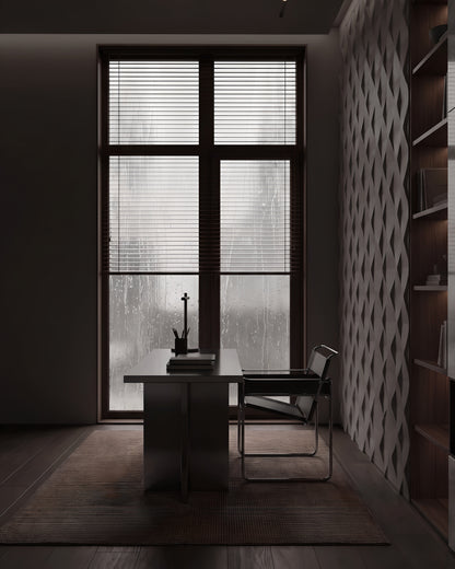 ROMBO 0118 gypsum 3D wall panels in a home office beside a rain covered window