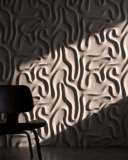 MYSTIC 0136 gypsum 3D wall panel relief in dramatic side light with a dark chair